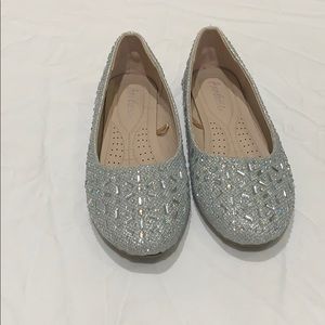Silver Flats shoes.